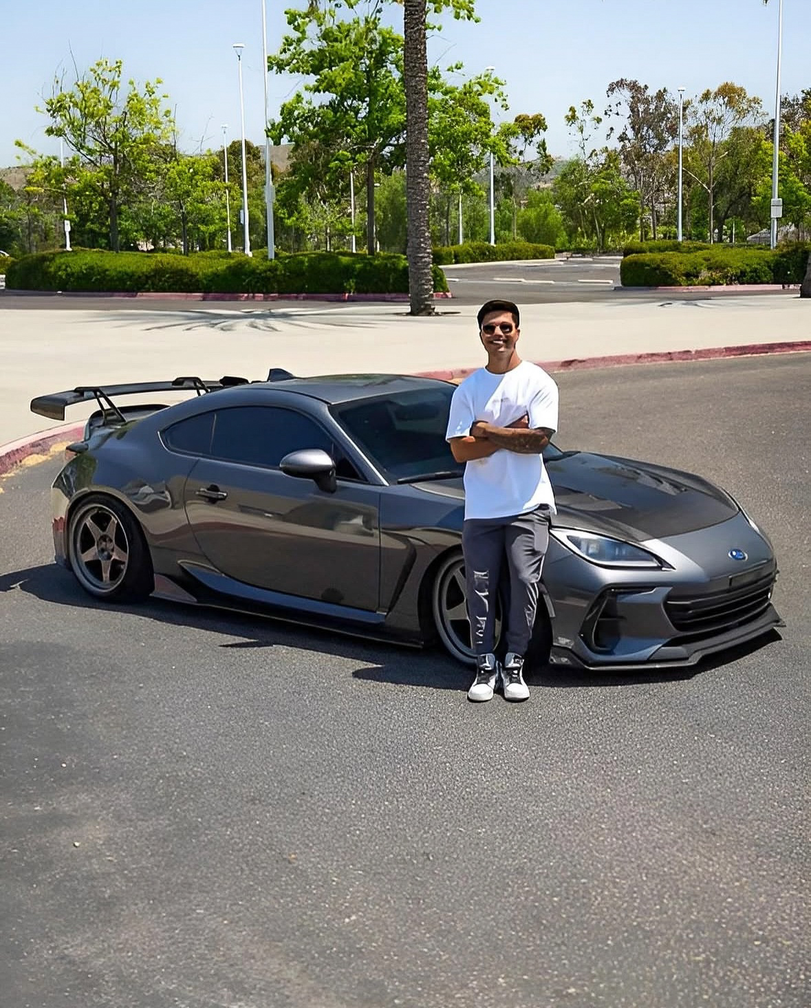 Glossy dark BMW inside a detailed garage after correction and protection work